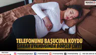 Telefonunu başucuna koydu, sabah uyandığında borçlu çıktı